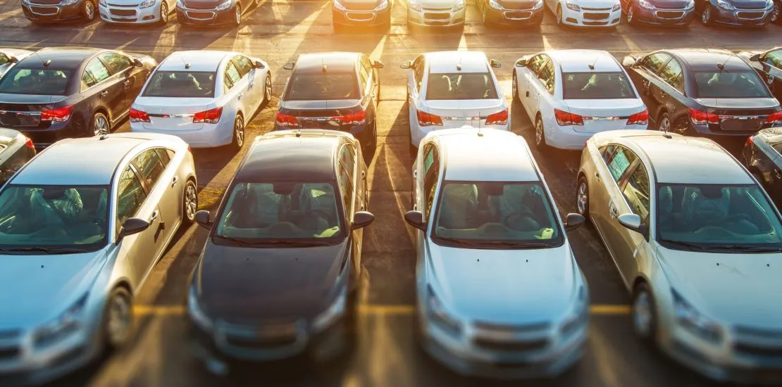 New cars lined up at a dealership